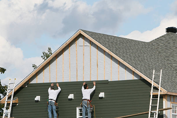 Professional Emergency Siding Repair technician working in Akron, CO